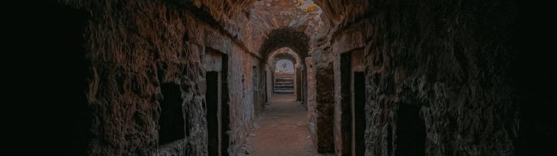 a dark tunnel with a light at the end