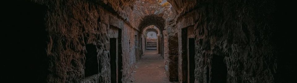 a dark tunnel with a light at the end