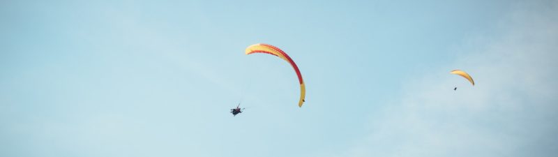 a person parachuting with a parachute
