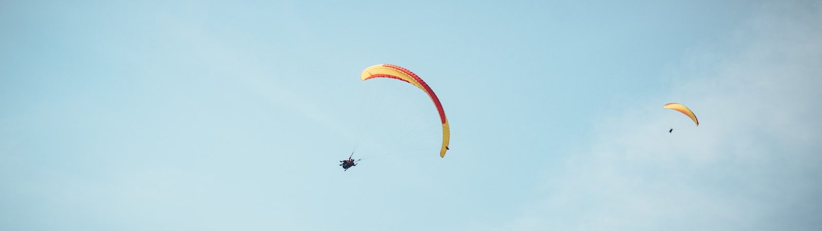 a person parachuting with a parachute