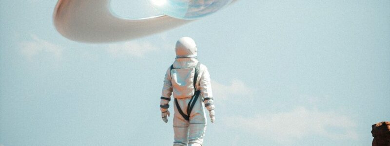 a man in a space suit standing on top of a rock